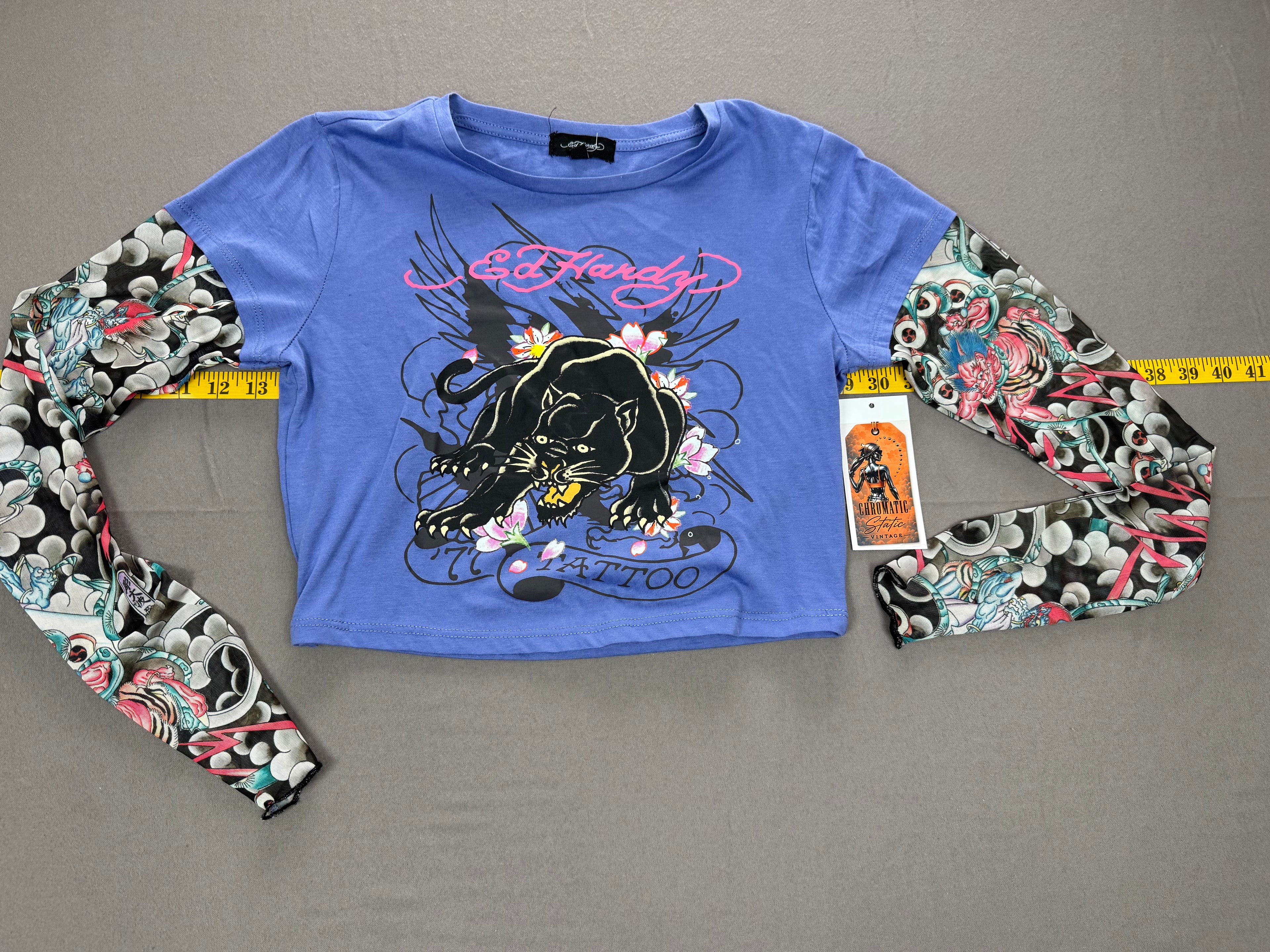 Ed Hardy – Women’s Layered Tattoo-Sleeve Graphic T-Shirt – Style #: EHW1415-6 – Size: Medium – Color: Purple / Blue / Multicolor
