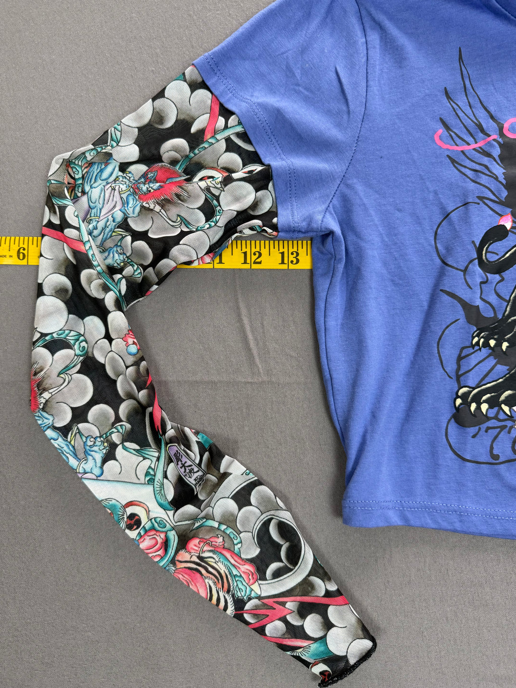 Ed Hardy – Women’s Layered Tattoo-Sleeve Graphic T-Shirt – Style #: EHW1415-6 – Size: Medium – Color: Purple / Blue / Multicolor