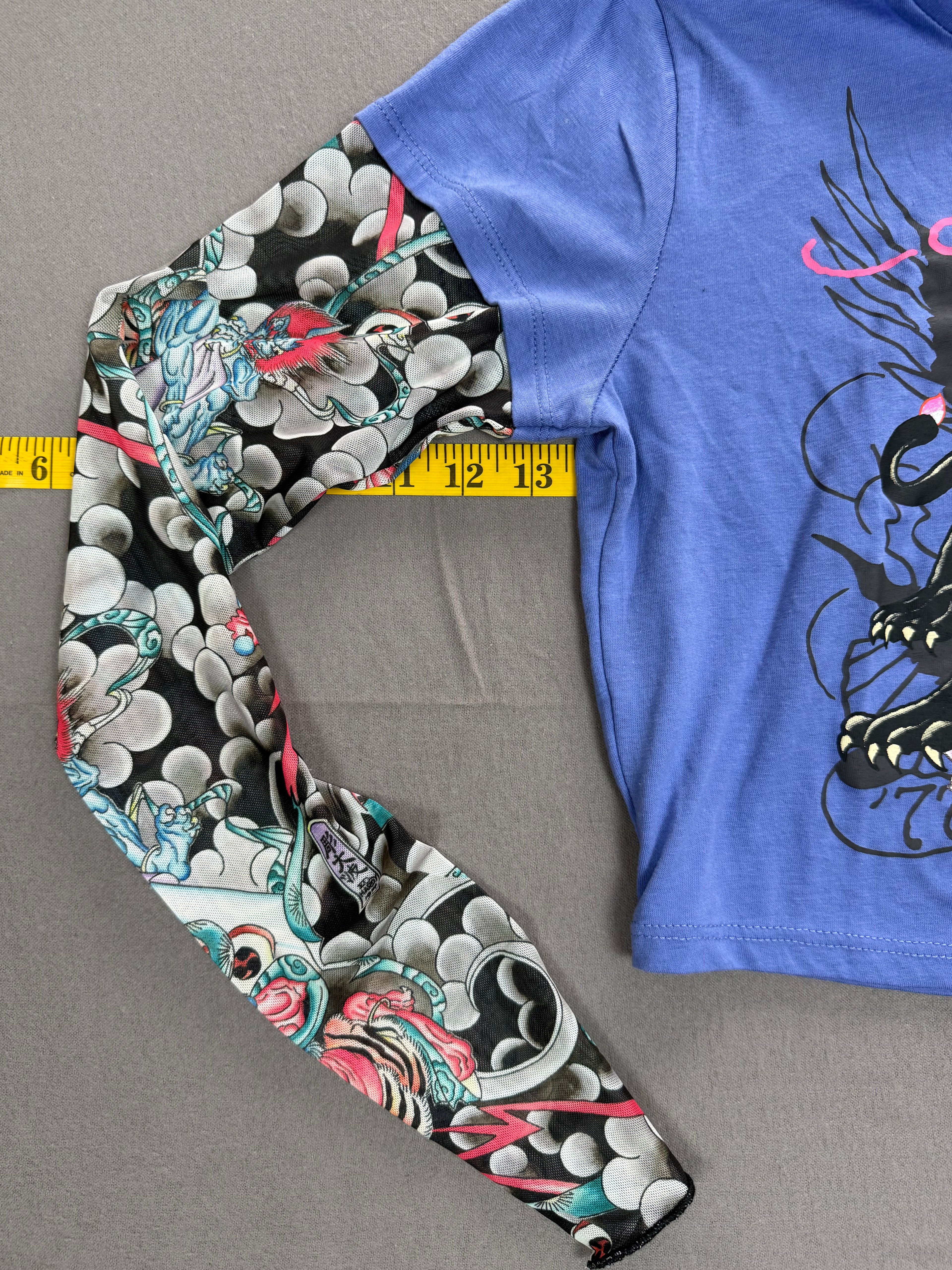 Ed Hardy – Women’s Layered Tattoo-Sleeve Graphic T-Shirt – Style #: EHW1415-6 – Size: Medium – Color: Purple / Blue / Multicolor