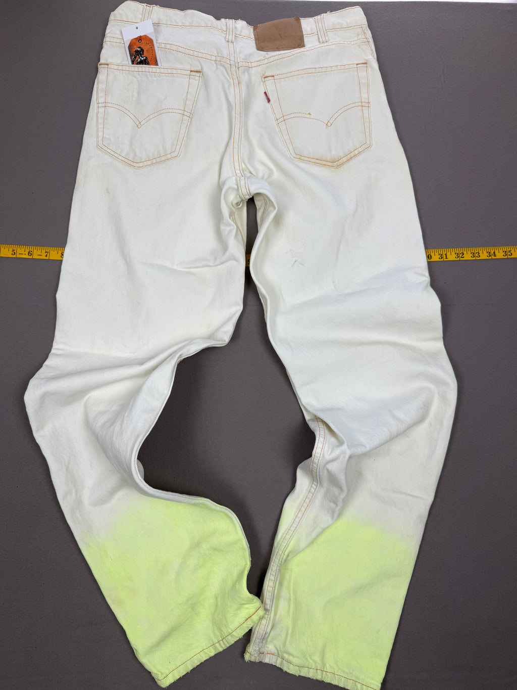 Vintage Levi’s 550 Antique White Jeans with Faded Neon Lime Hem