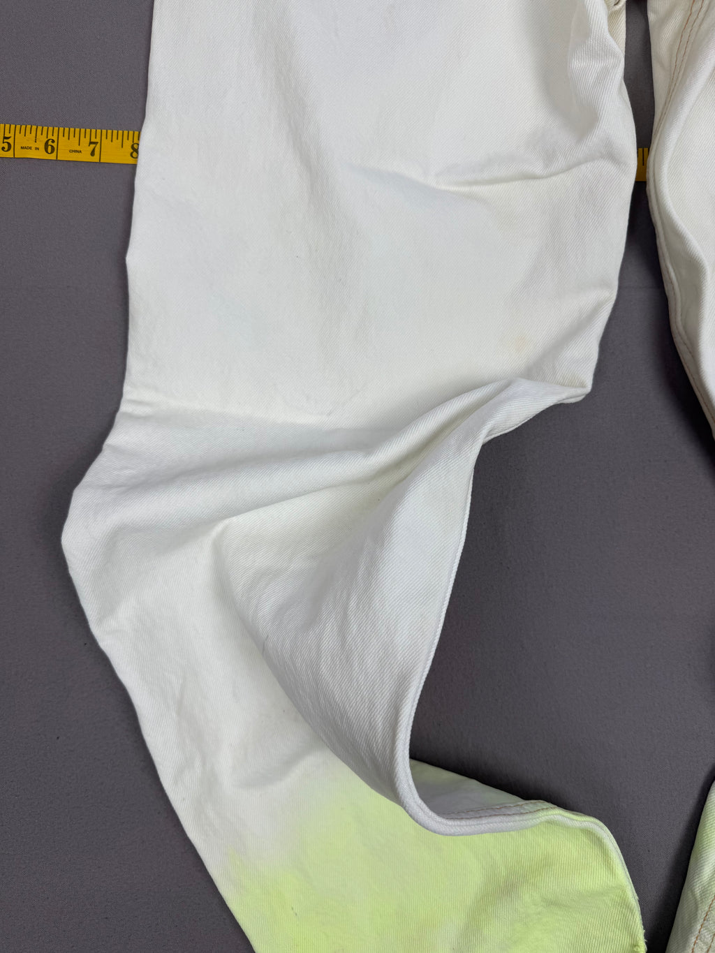 Vintage Levi’s 550 Antique White Jeans with Faded Neon Lime Hem